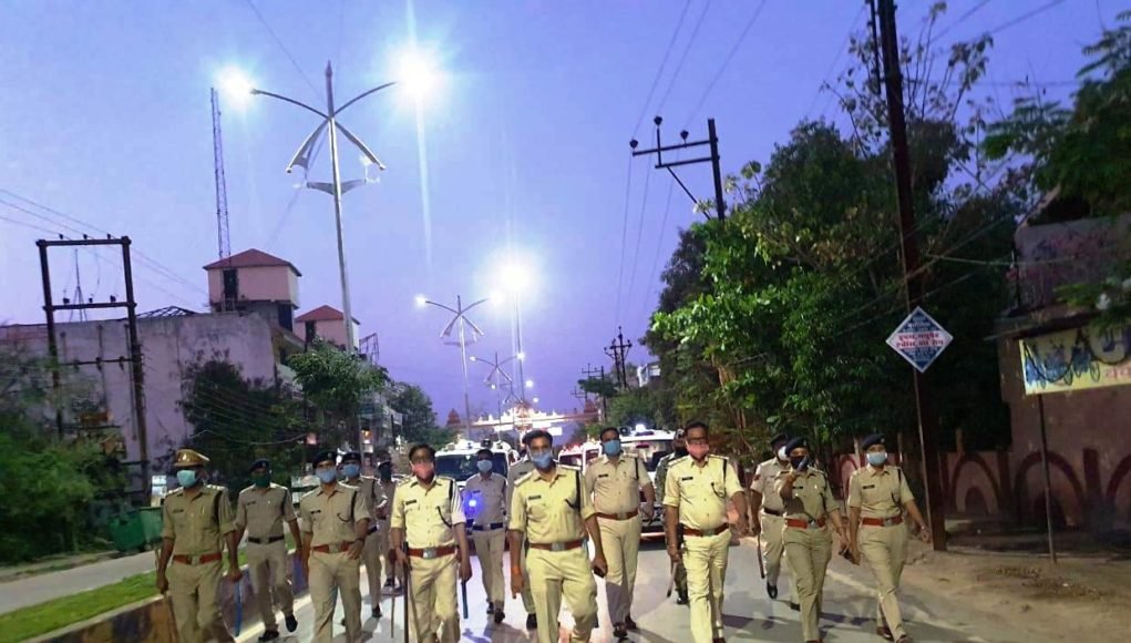 Police march past corona